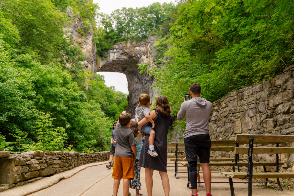 Family admiring the Natural Bridge at Natural Bridge State Park in Lexington, Virginia, United States